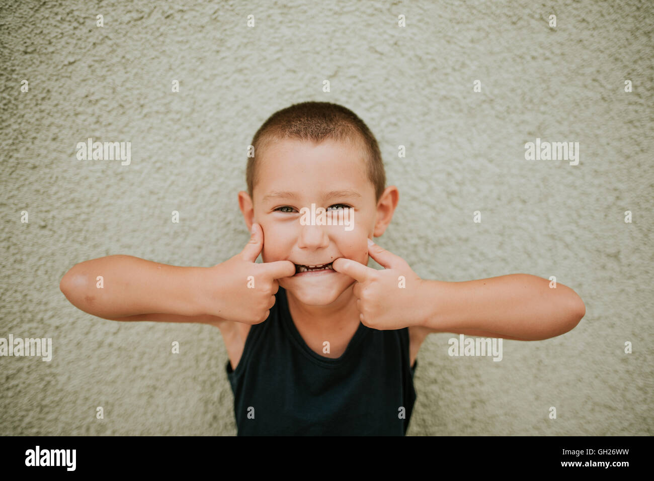 Preschooler boy making funny faces Stock Photo