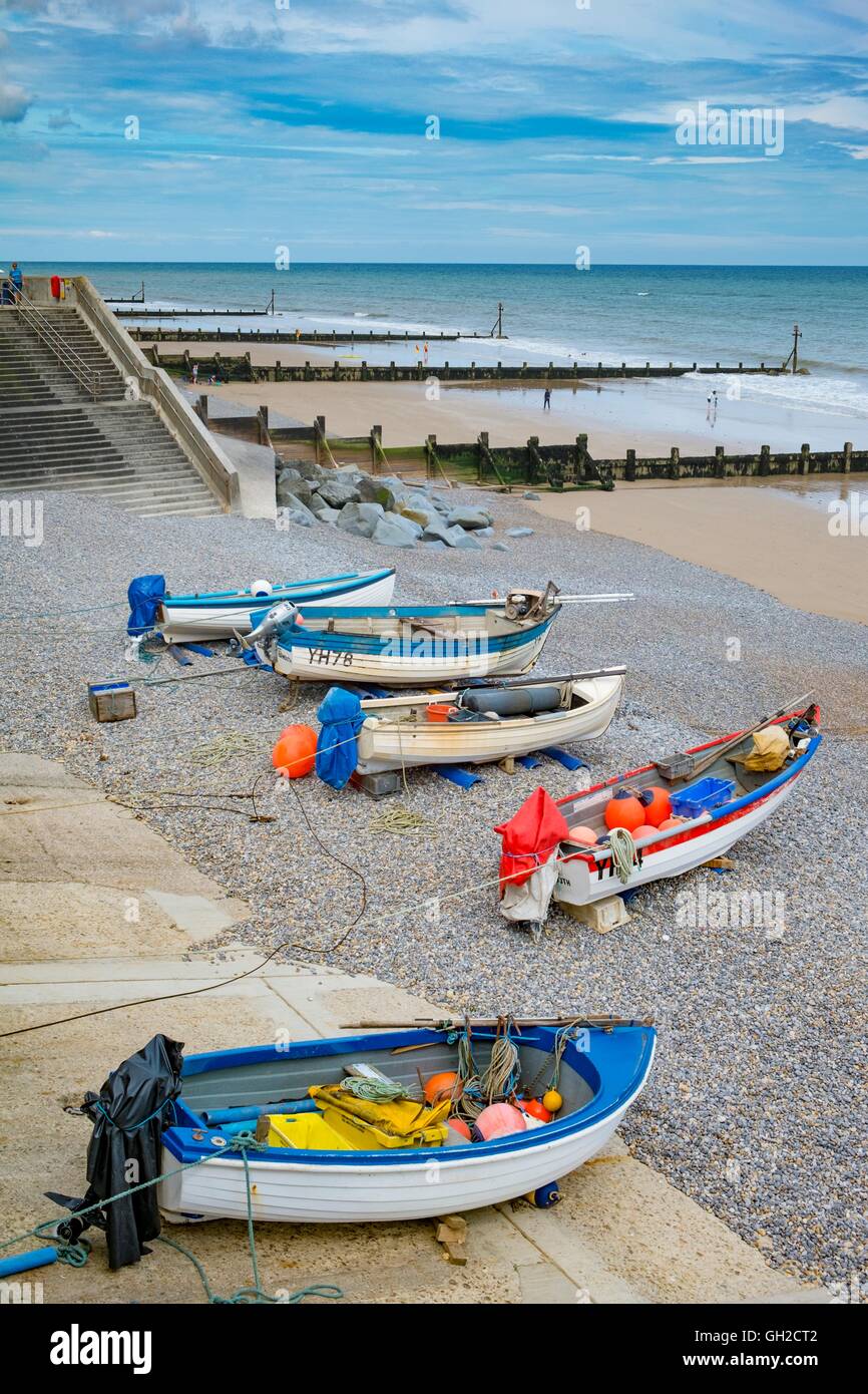 Crab & Lobster fishing boats hauled up on shingle beach, England, July, Norfolk, Sheringham Stock Photo