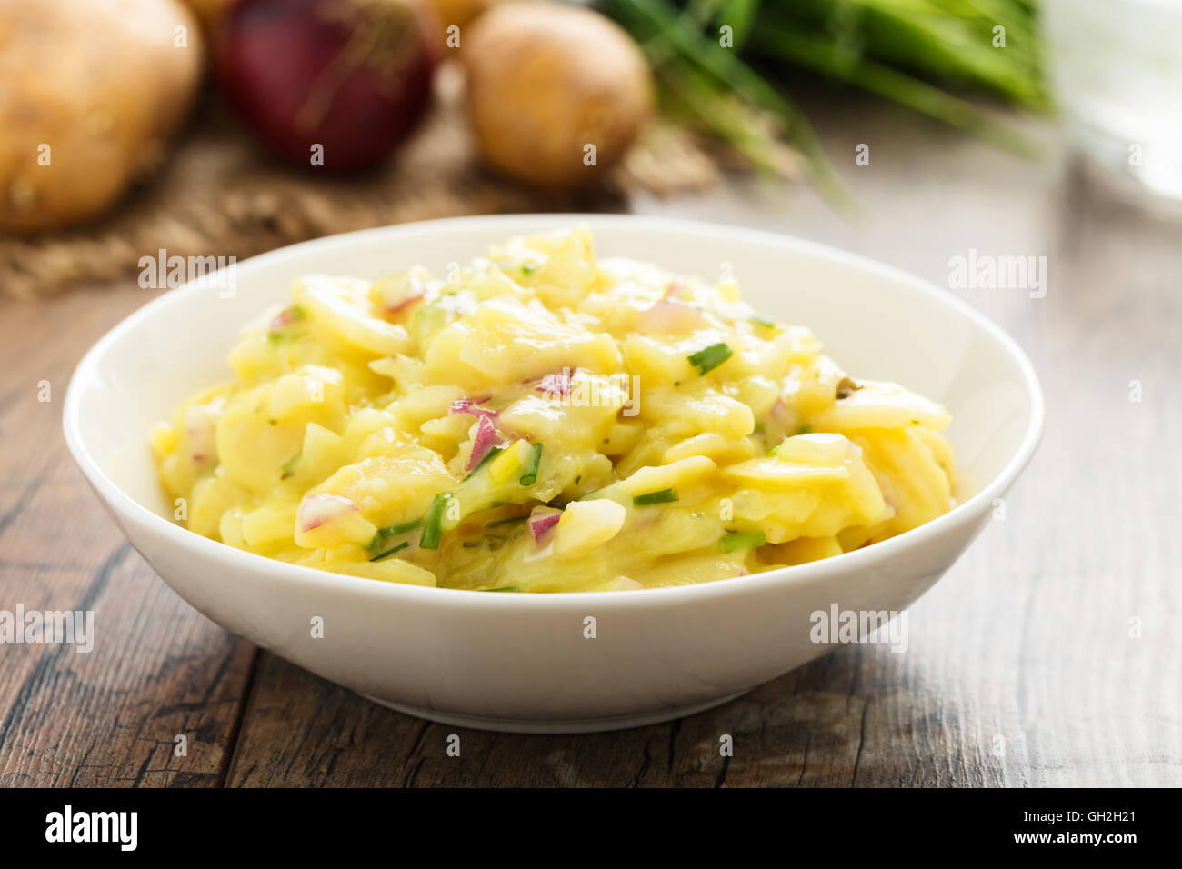 fresh potato salad with red onion and chives Stock Photo Alamy