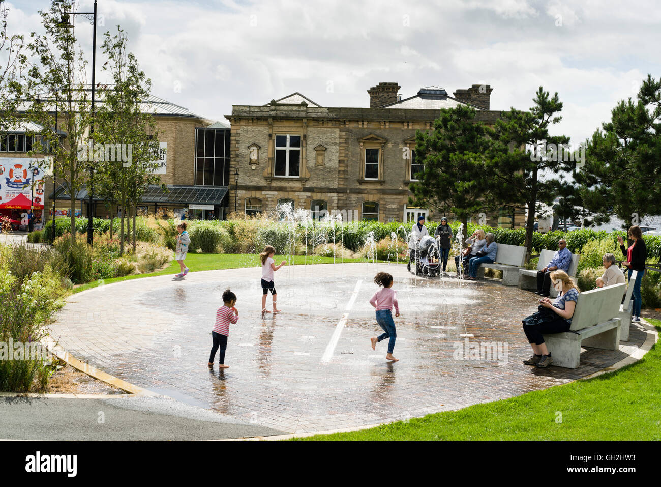 The Customs House arts and theatre, gallery, café complex at Harton Quay South Shields, Tyneside. Children play in fountain. Stock Photo