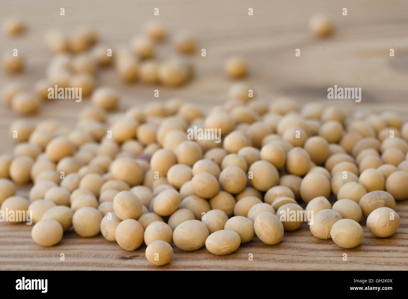 closeup to soya beans on wooden background Stock Photo