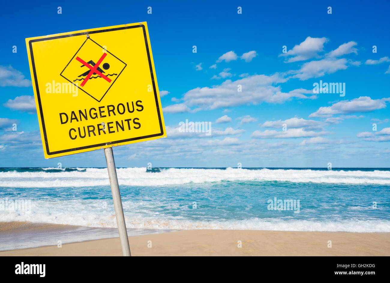 Dangerous currents sign on a beach Stock Photo