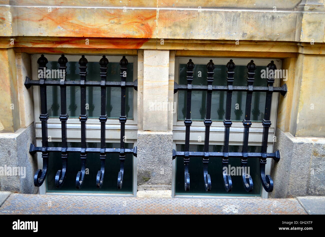 window with metal bars on street level Stock Photo