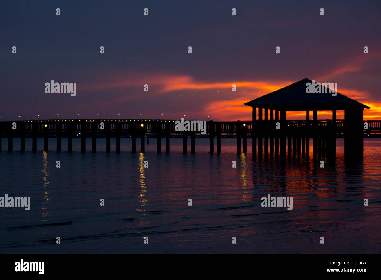 Intense sunset behind a fishing pier in Ocean Springs, Mississippi
