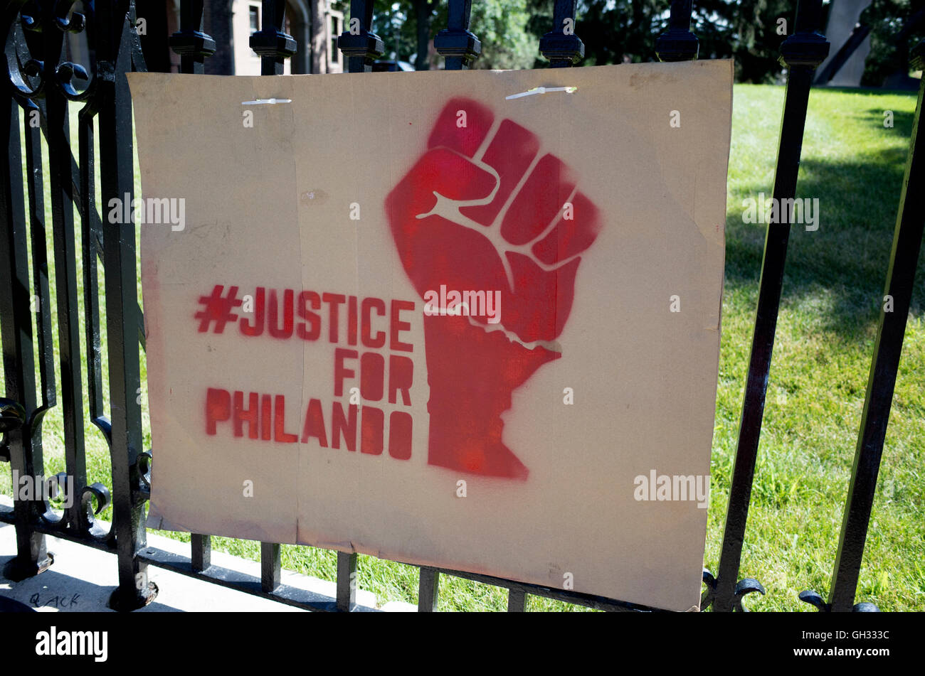 Clenched fist poster # Justice for Philando's police shooting on fence in front of governor's mansion. St Paul Minnesota MN USA Stock Photo