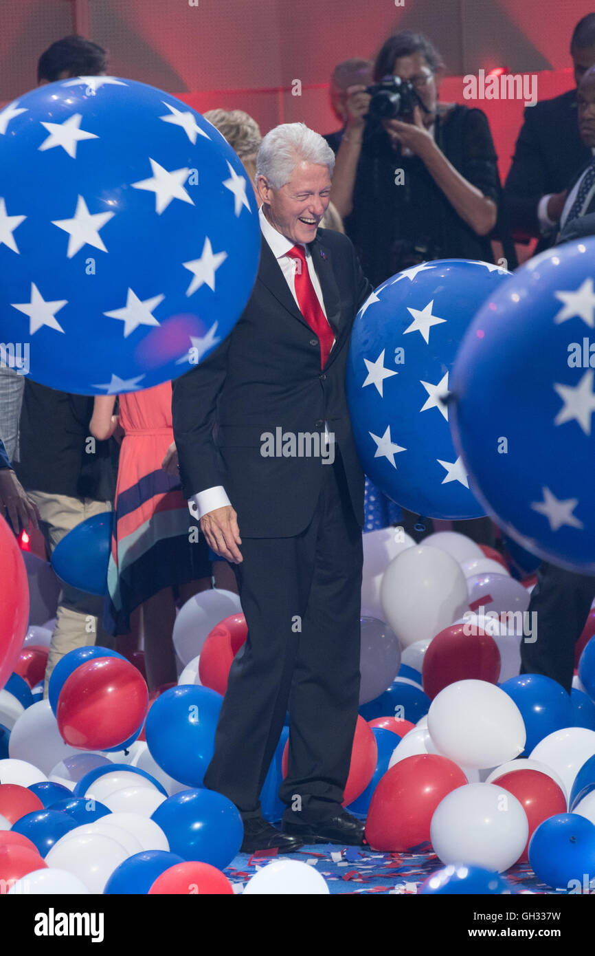 Former President Bill Clinton kicks balloons during the finale of the Democratic National Convention at the Wells Fargo Center July 28, 2016 in Philadelphia, Pennsylvania. Stock Photo