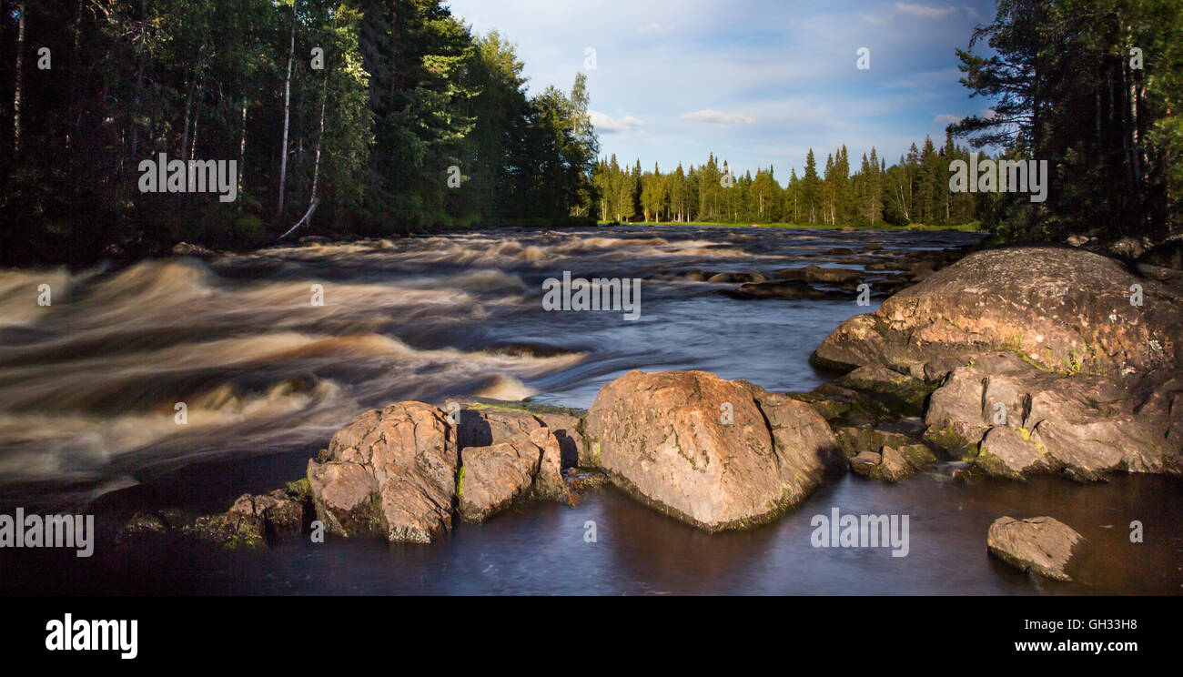 Fast moving river in Finish Lapland Stock Photo
