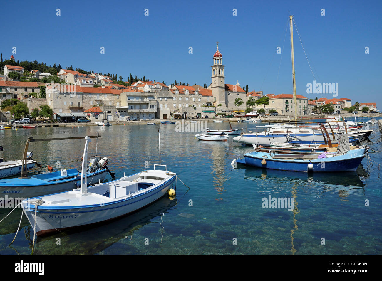 geography / travel, Croatia, fishing boat in the harbour of Sutivan in front of the church Sveti Ivan, Sutivan, Brac isle, Dalmatia, Additional-Rights-Clearance-Info-Not-Available Stock Photo