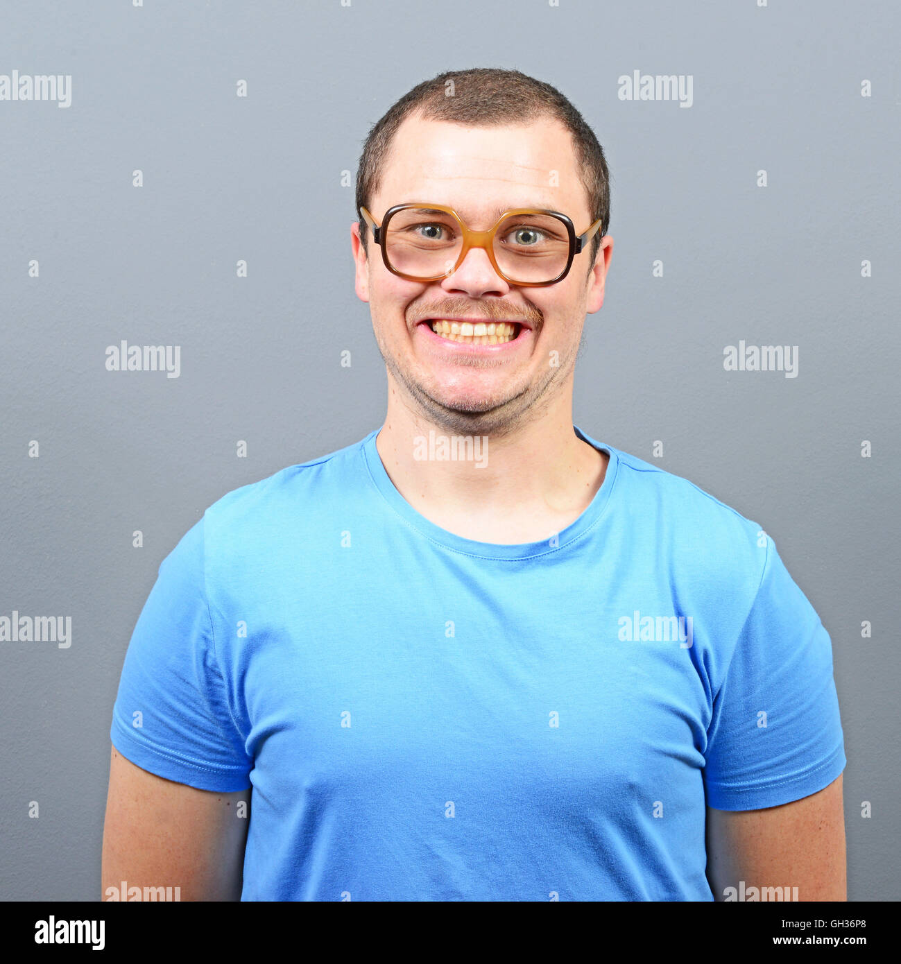 Portrait of a geek looking guy with huge glasses Stock Photo - Alamy