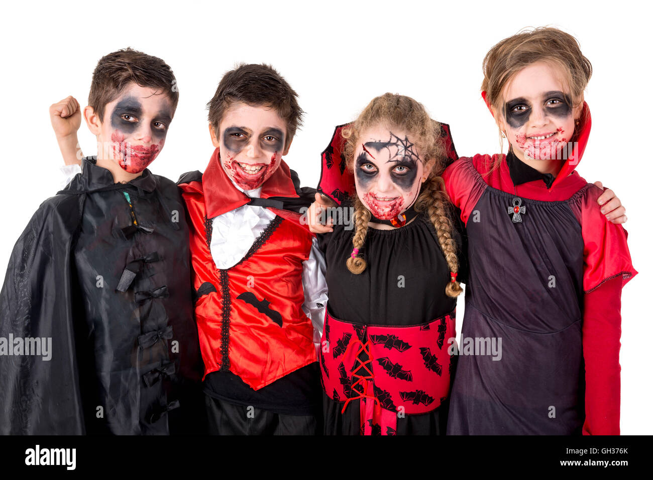 Group of kids with face-paint and Halloween vampire costumes Stock ...