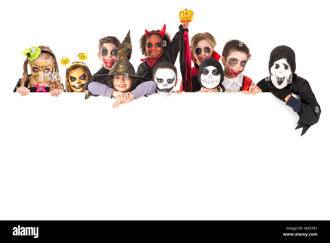 Group of kids with face-paint and Halloween costumes Stock Photo - Alamy