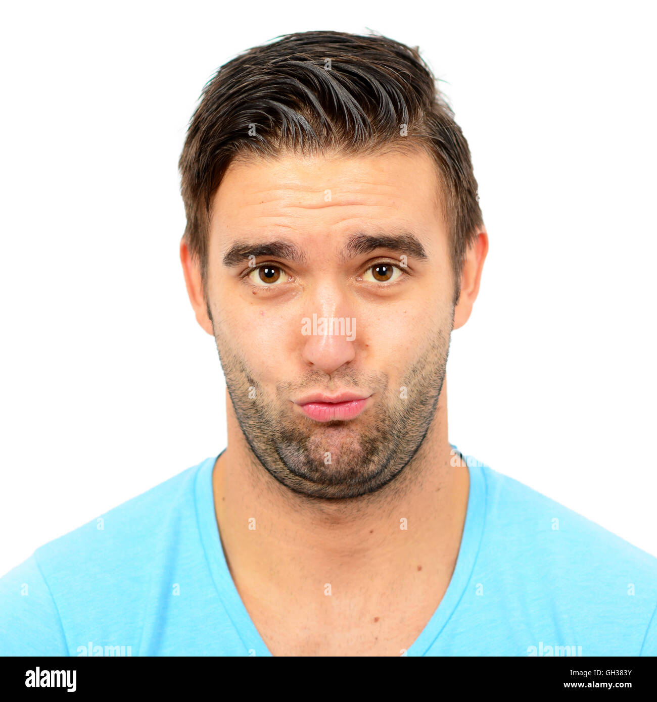 Portrait of clueless man against white background Stock Photo - Alamy