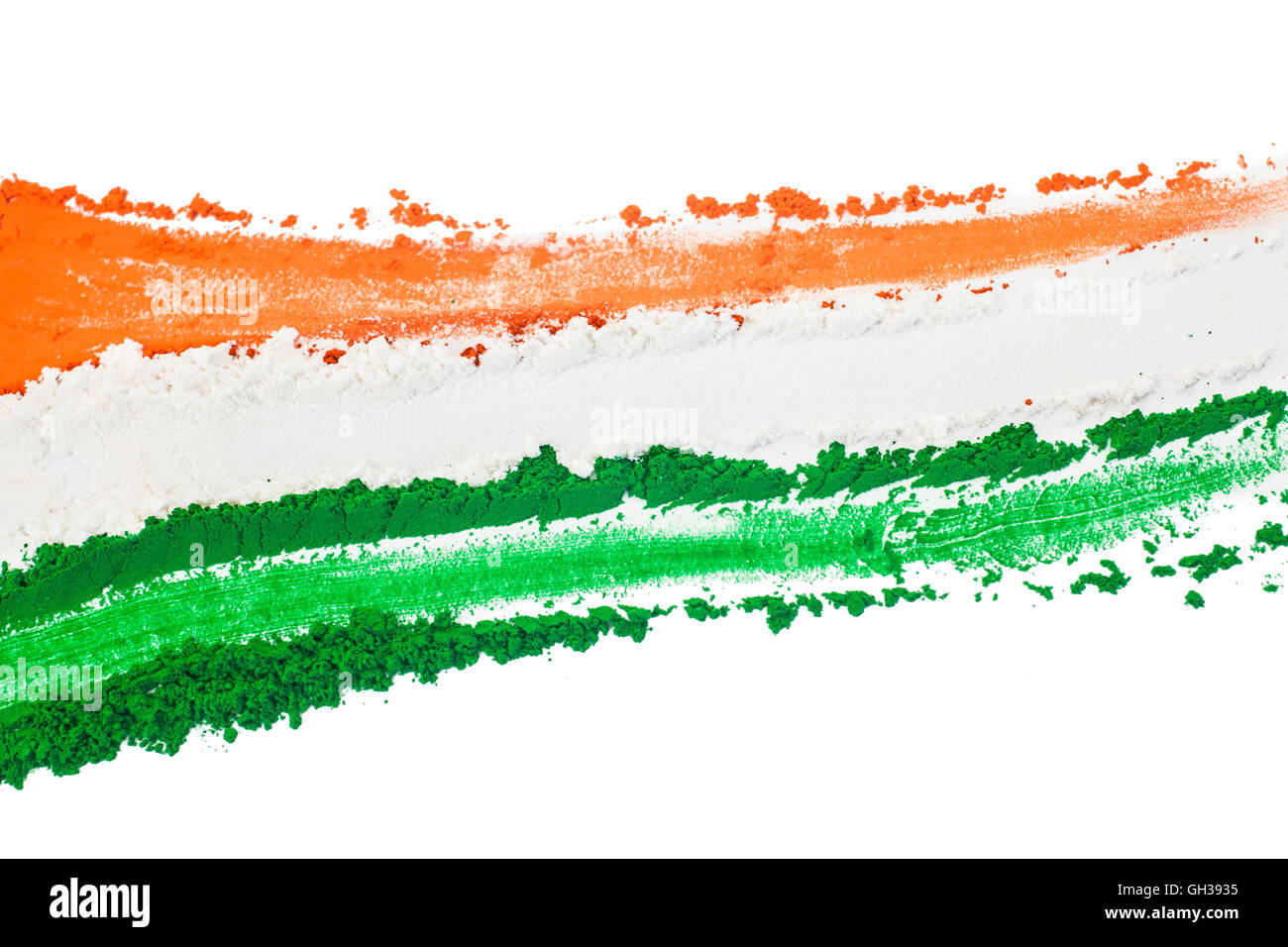 The tricolor of the Indian national flag painted with dye powder and isolated on white. Stock Photo