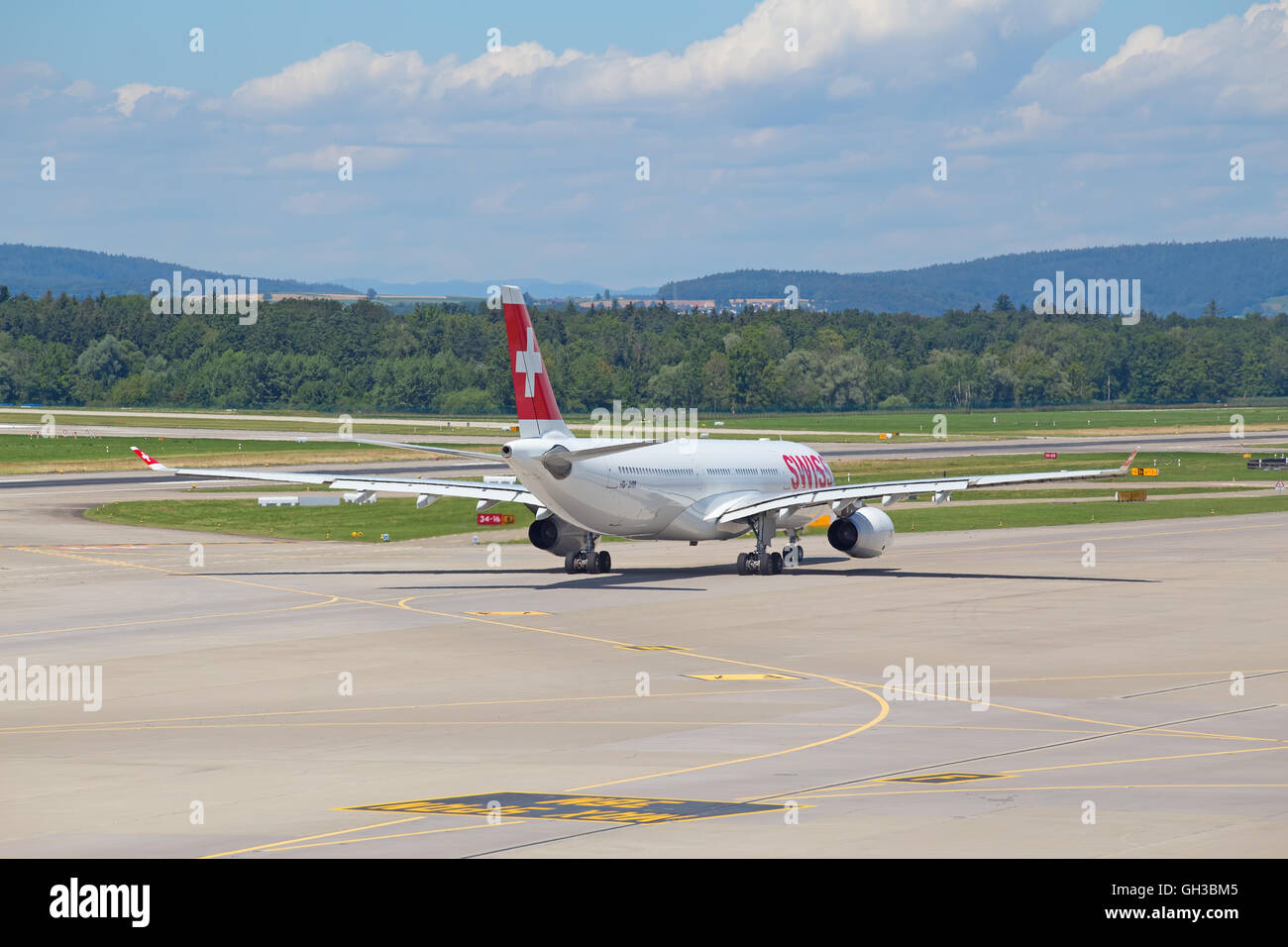 ZURICH - July 30:  Planes preparing for take off at Terminal A of Zurich Airport on July 30, 2016 in Zurich, Switzerland. Zurich Stock Photo