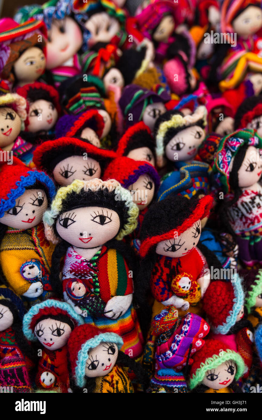close up of a group pf dolls in a variety of classic Peruvian colors for sale in the Market at Pisac Stock Photo