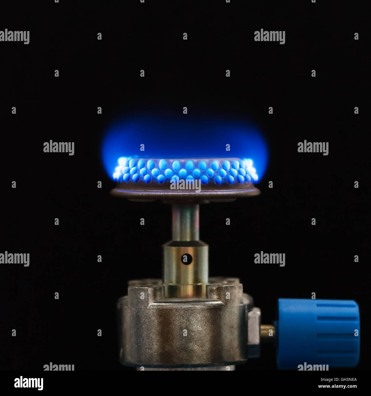 Propane gas burner with blue Bunsen flame. Used for stoves and in laboratory for heating