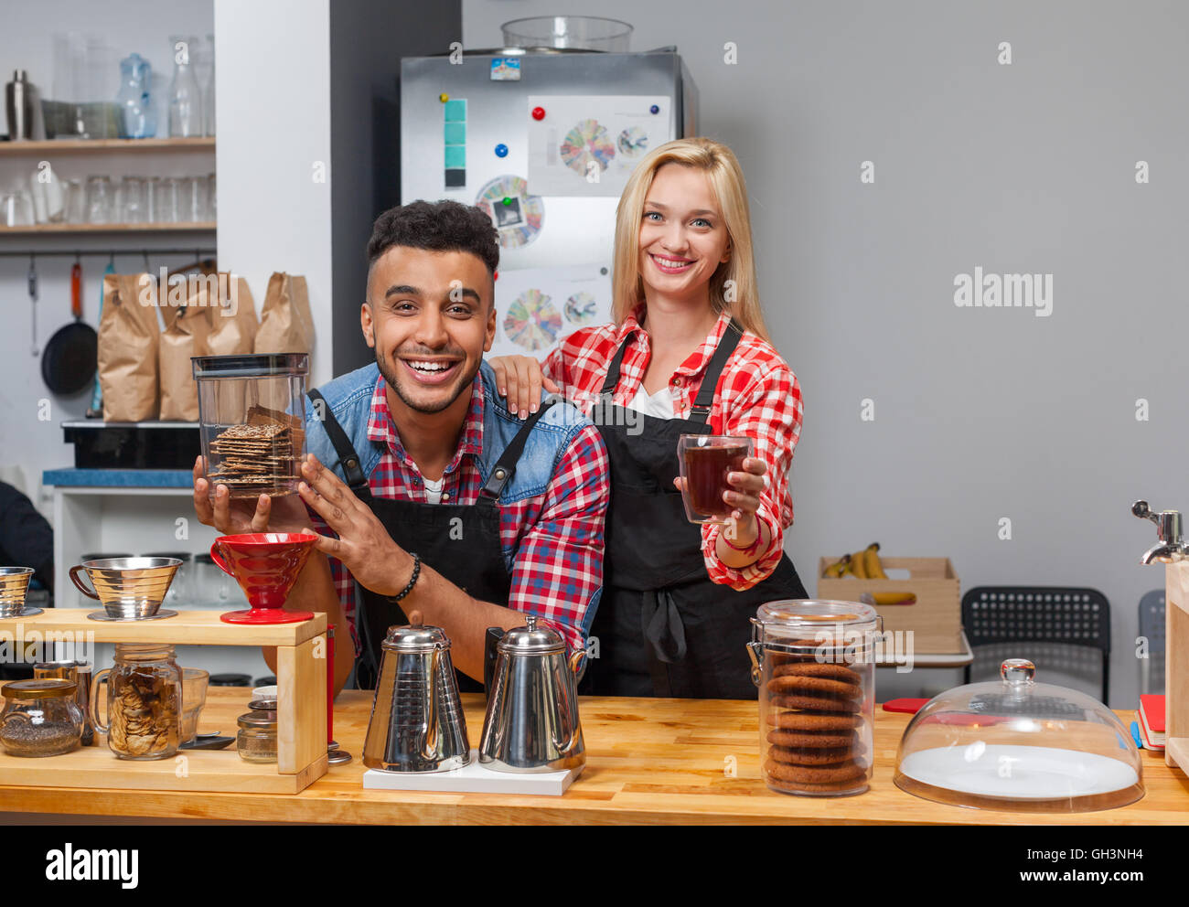 Barista coffee shop owner couple happy smile at bar counter Stock Photo