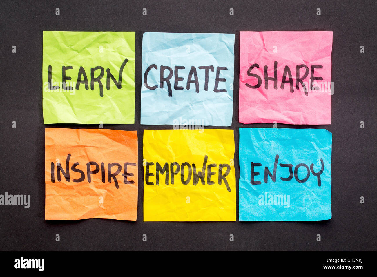 learn, create, share, inspire, empower and enjoy -  set of sticky notes with inspirational words and smiley Stock Photo