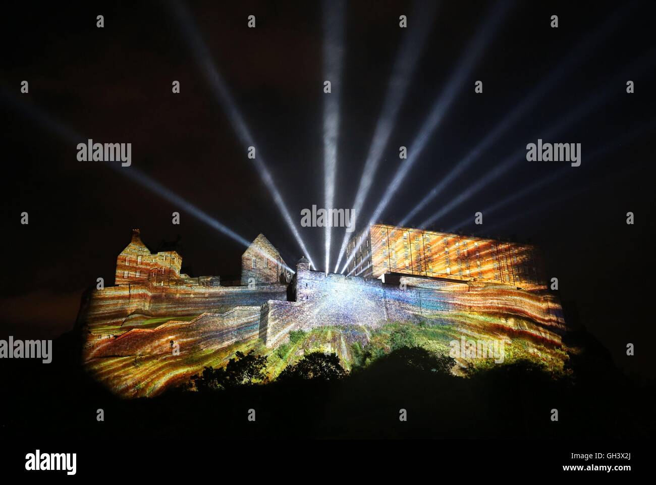 A series of digitally animated projections takes place across the western facade of Edinburgh Castle during the Standard Life Opening Event: Deep Time, at Castle Terrace, Edinburgh, Scotland, which marks the official start of the 2016 Edinburgh International Festival. Stock Photo