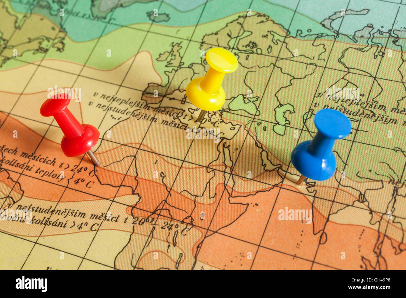 Push pins showing the location of a destination point on a temperature map Stock Photo