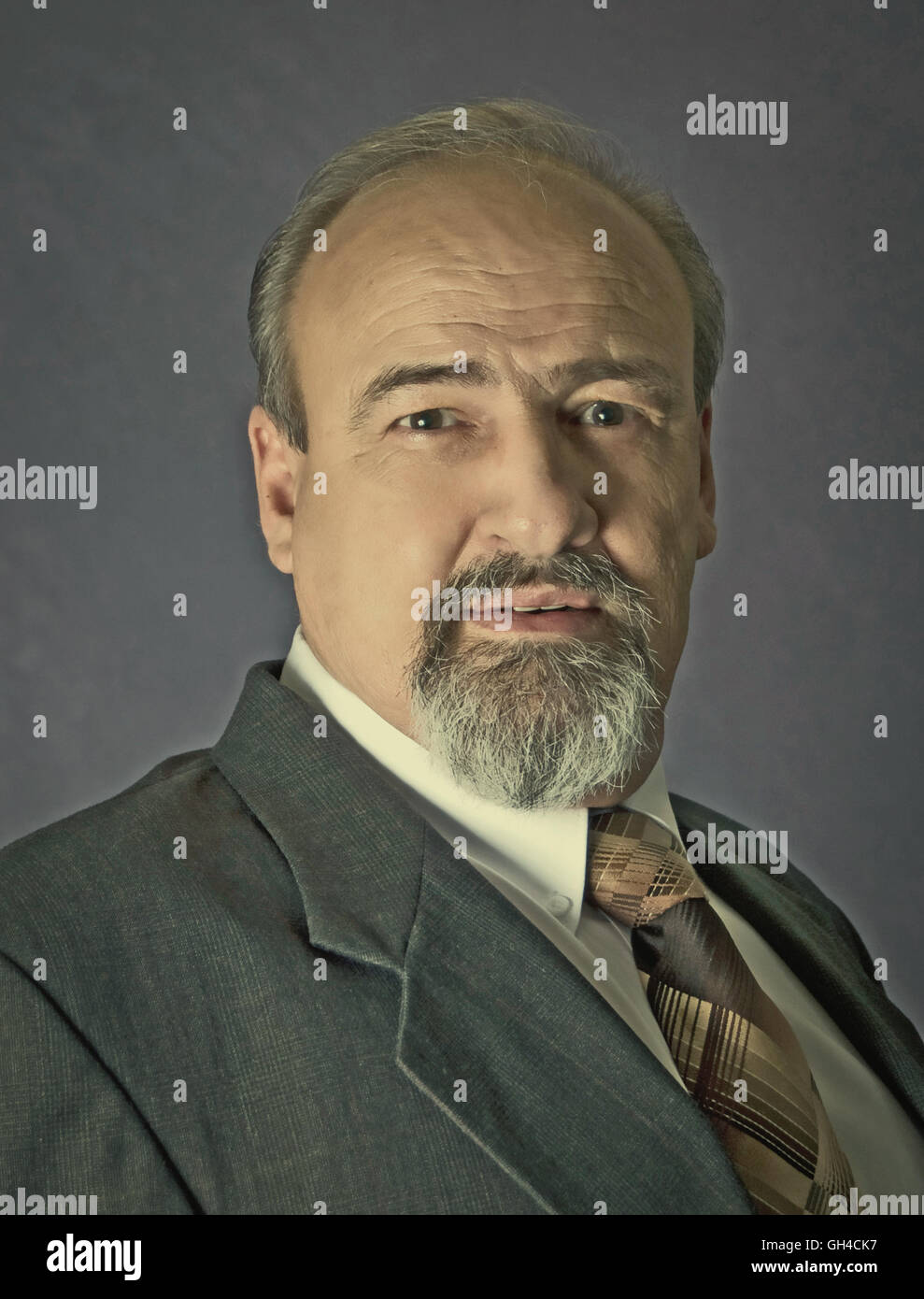 Adult male head and shoulders wearing a suit and tie. Retro instagram