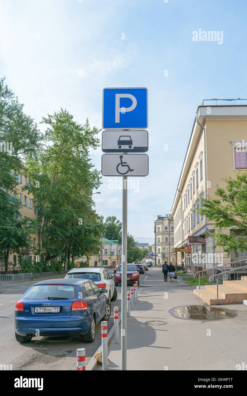Road sign indicating the parking space for the invalid passenger cars Stock Photo
