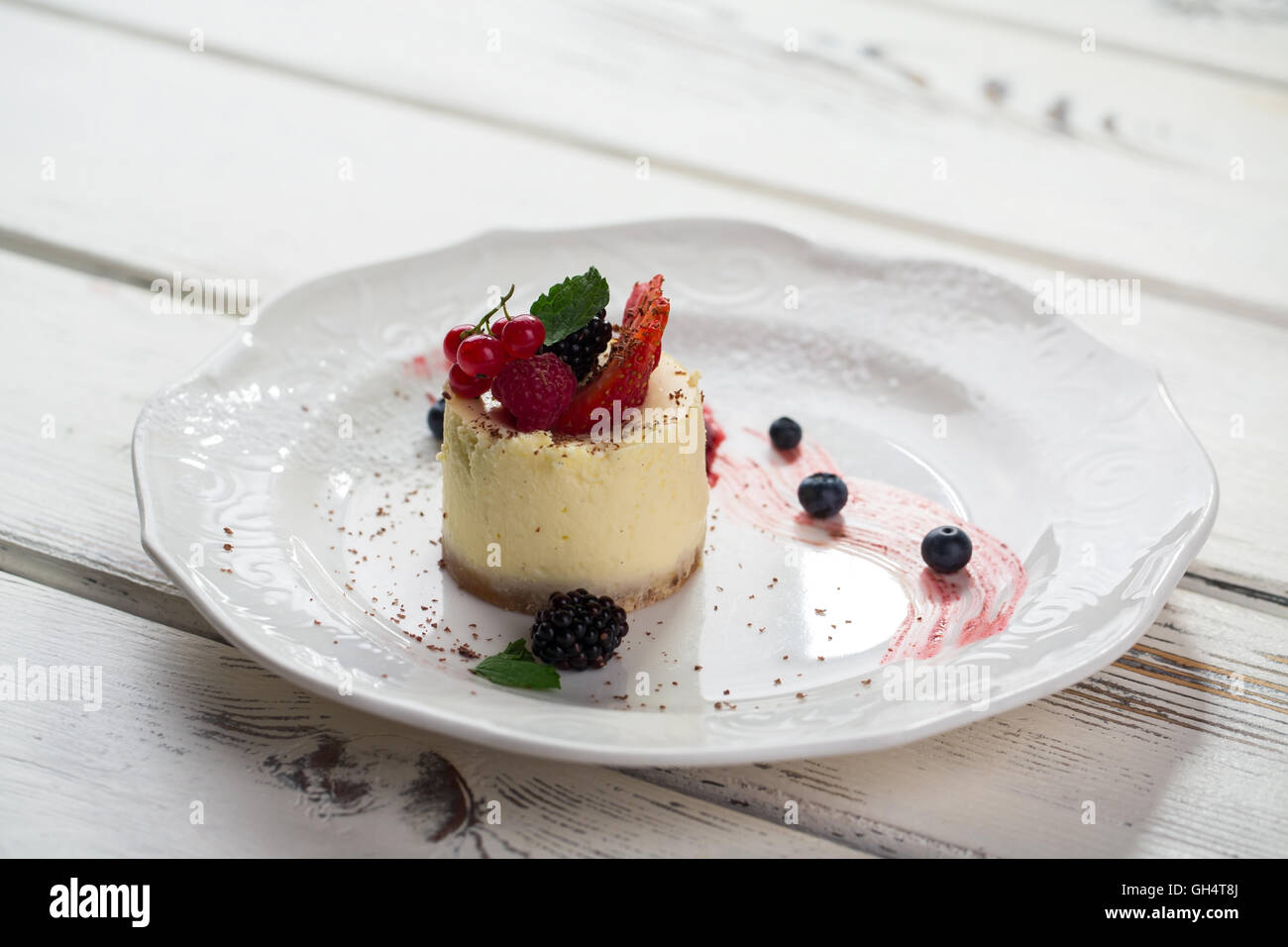 Small cake on plate Stock Photo Alamy