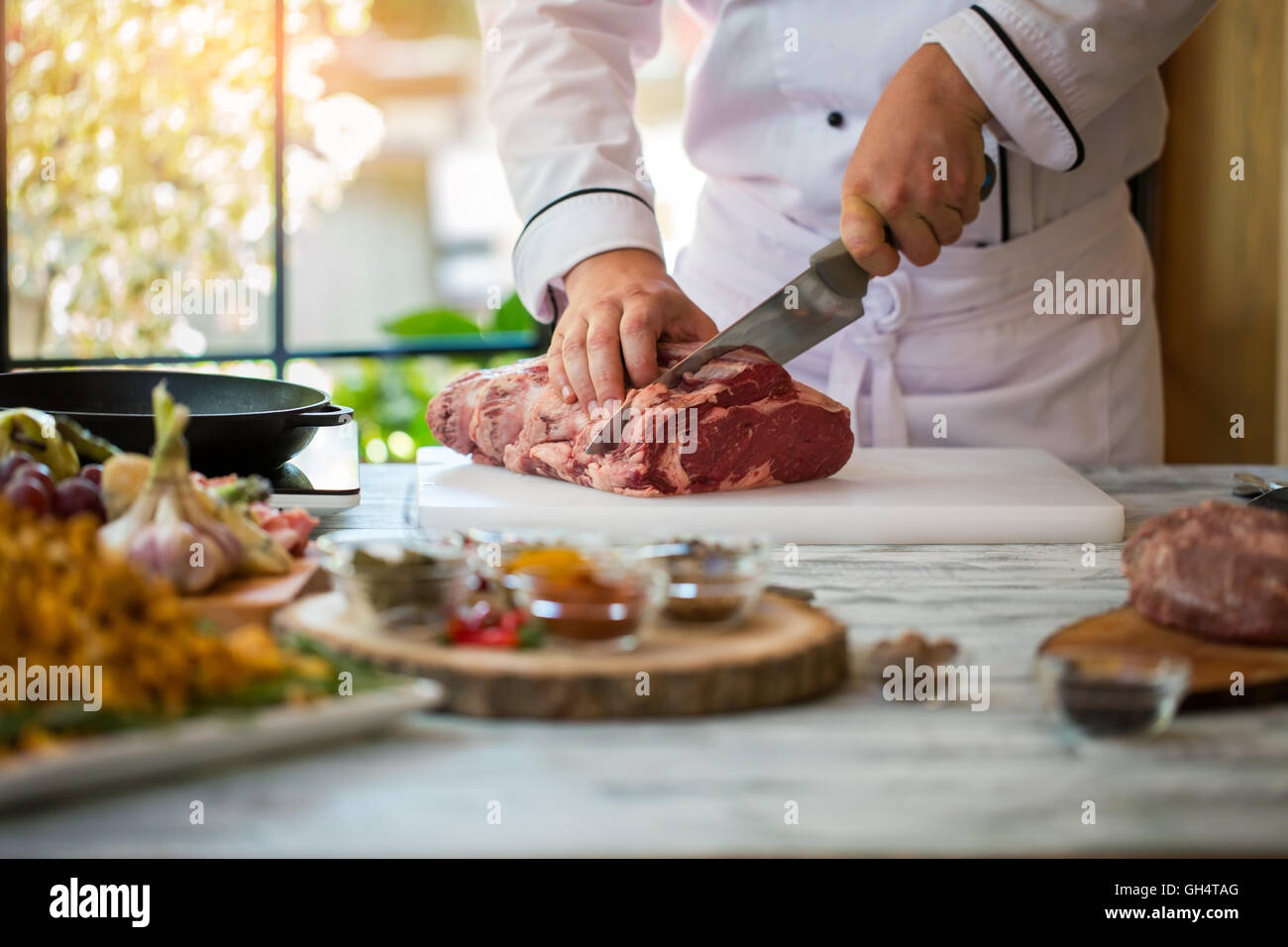 Hand with knife cuts meat Stock Photo Alamy