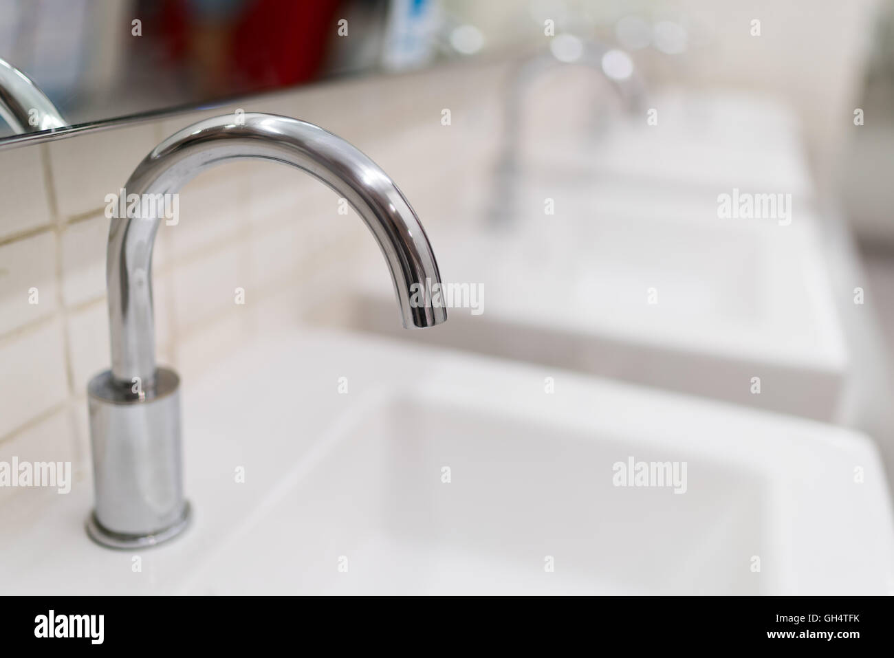 Modern water faucet in toilet, depth of field effect Stock Photo