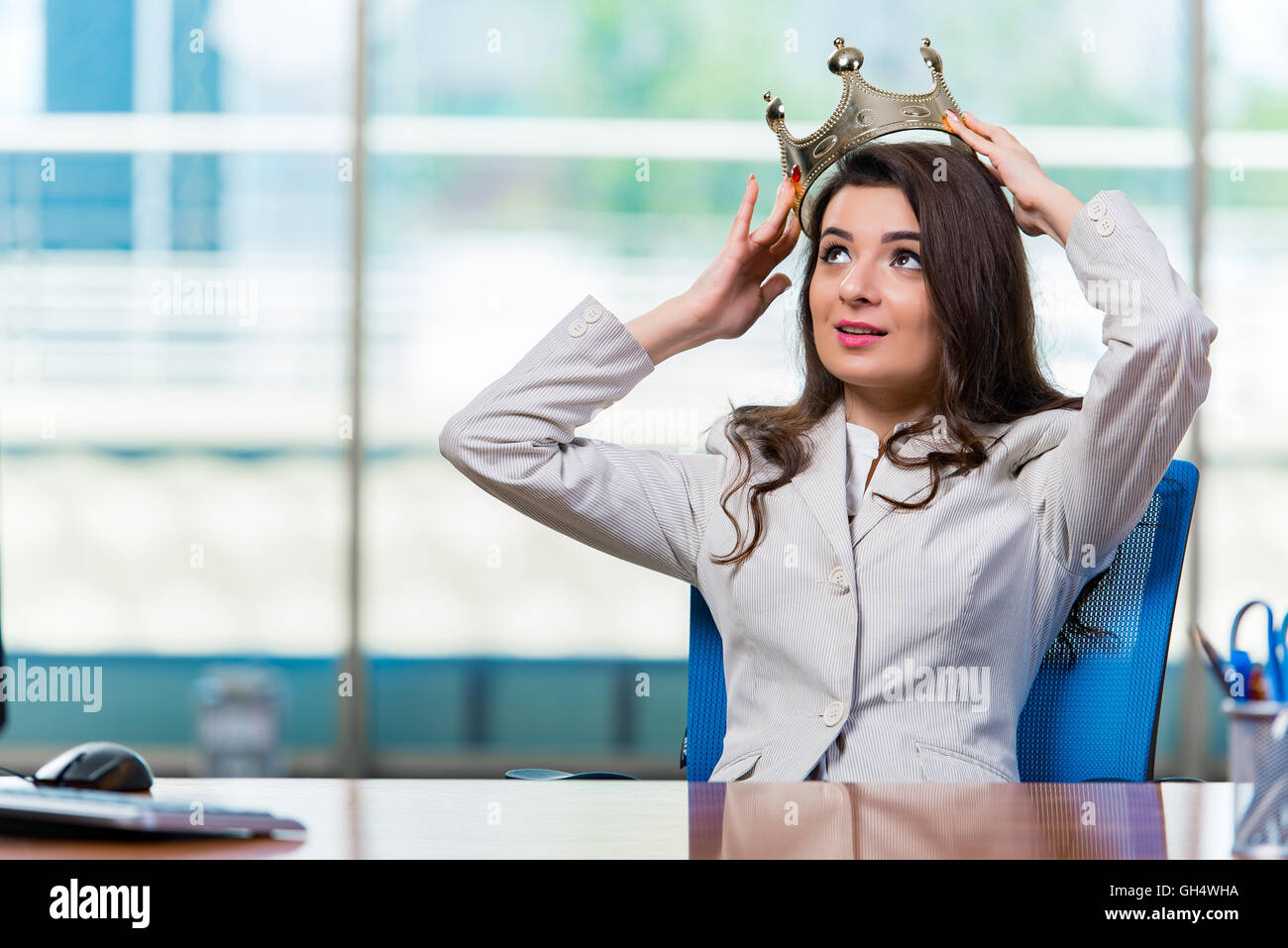 Businesswoman sitting at the office desk Stock Photo - Alamy
