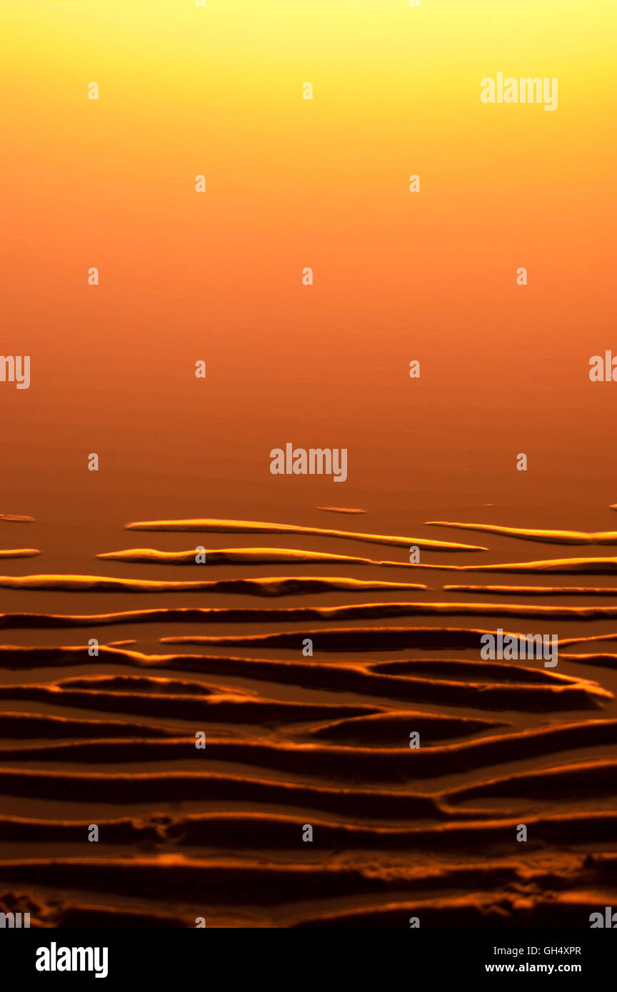 Background close-up detail of sand ribs and water in the graduated ...