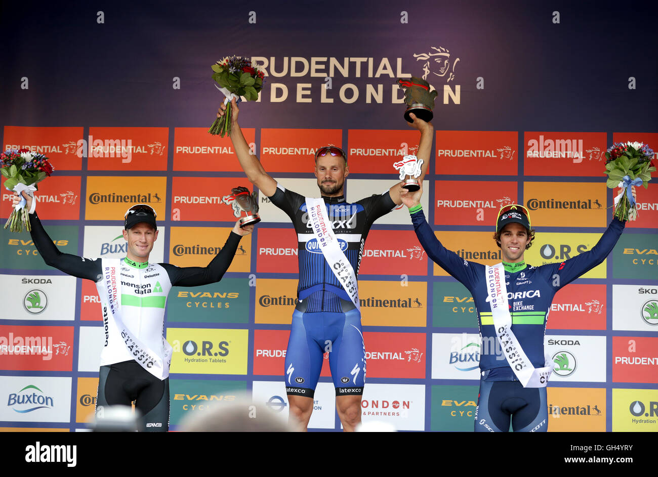 Winner Tom Boonen, from Etixx - Quick Step (centre), with Mark Renshaw of Dimension Data (left) and Michael Matthews of Orica-BikeExchange (right) after the RideLondon Classic during day two of Prudential RideLondon. Stock Photo