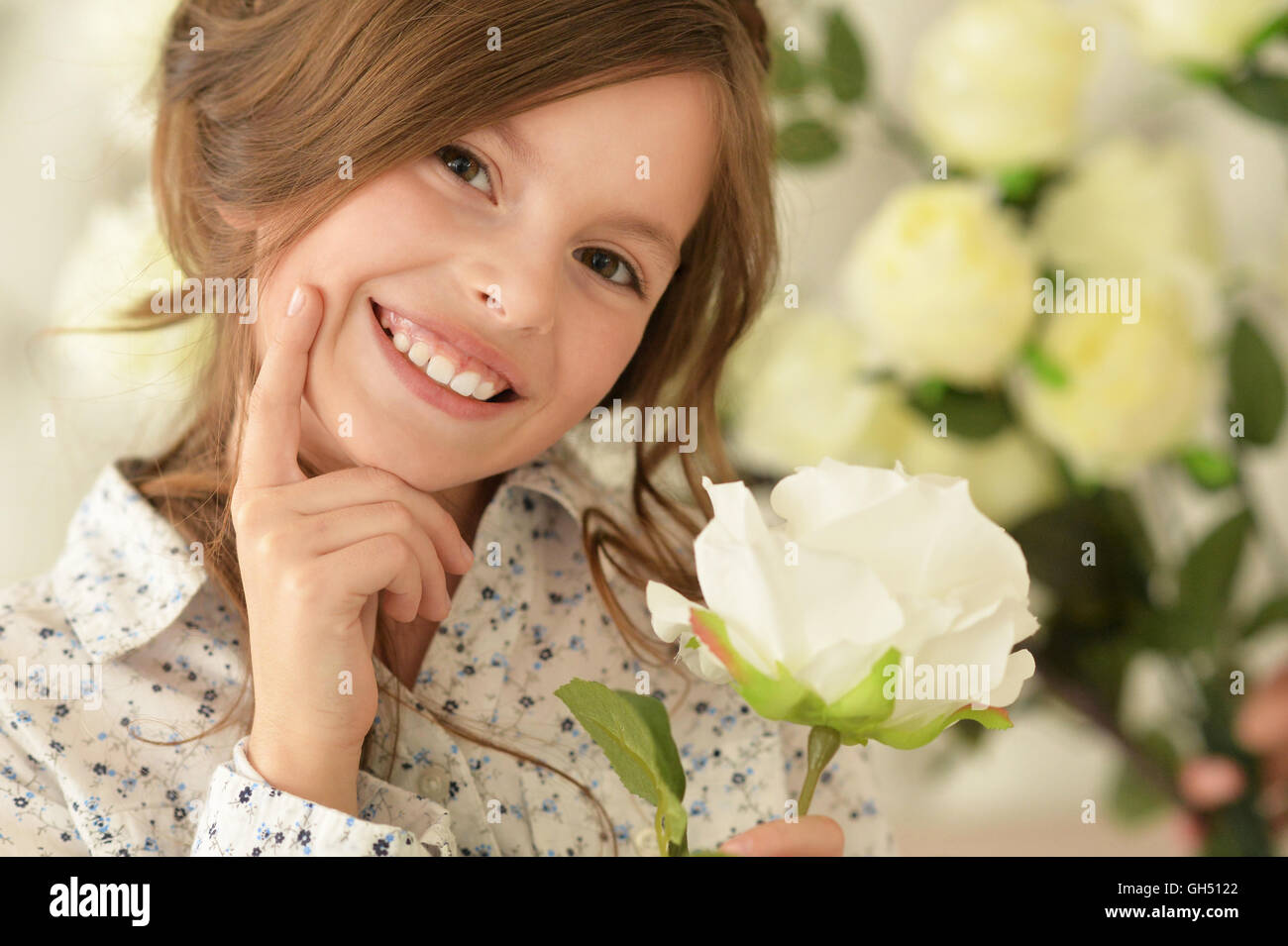 cute little girl posing with flower Stock Photo - Alamy