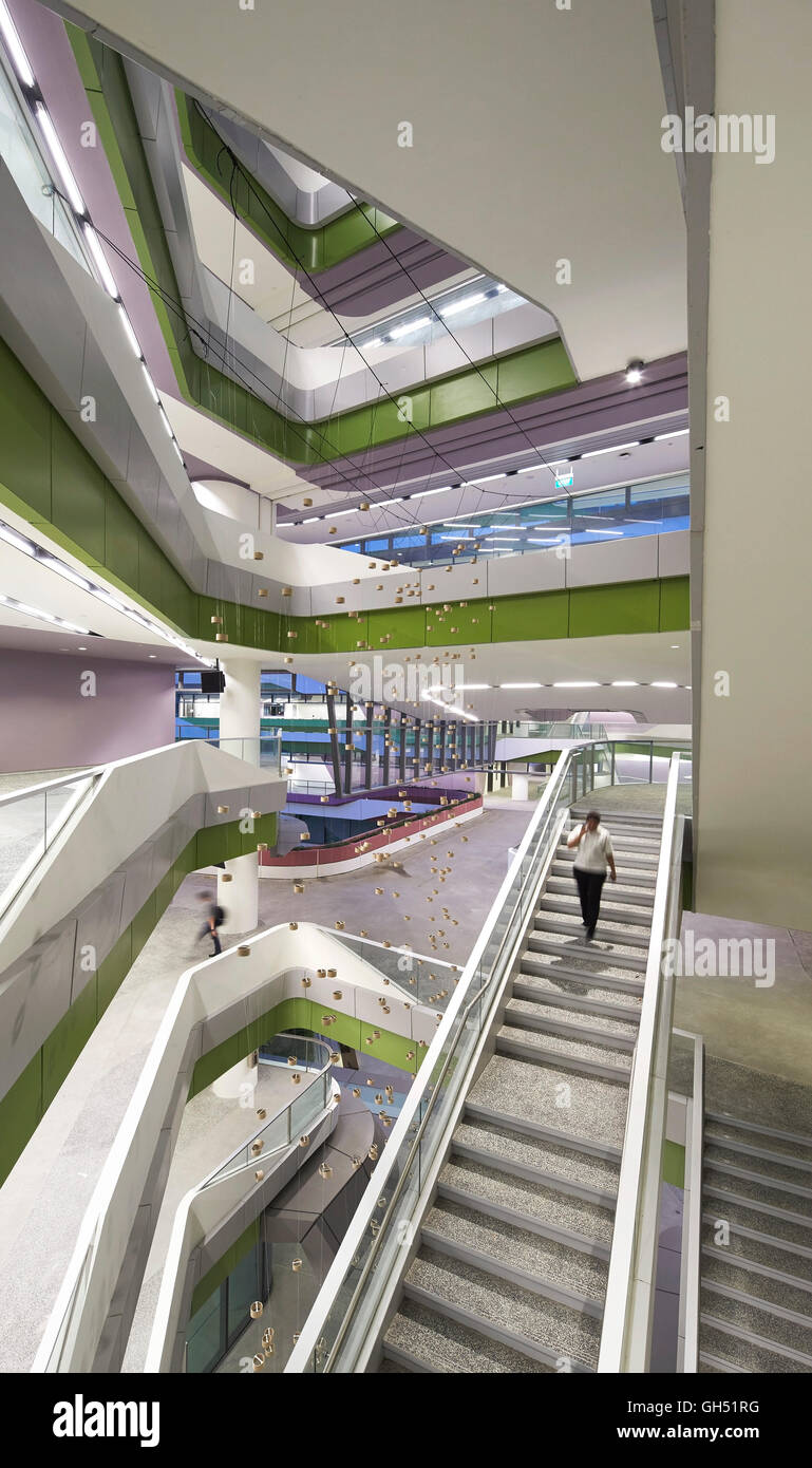 Overall view of full-height atrium with staircase. Singapore University of Technology and Design, Singapore, Singapore. Architect: UNStudio, 2015. Stock Photo