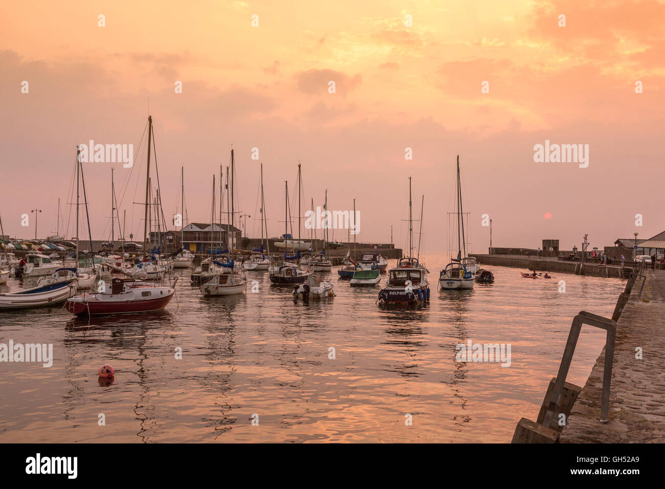 A summer sunset in the harbour at Aberaeron, Ceredigion, Wales, UK Stock Photo