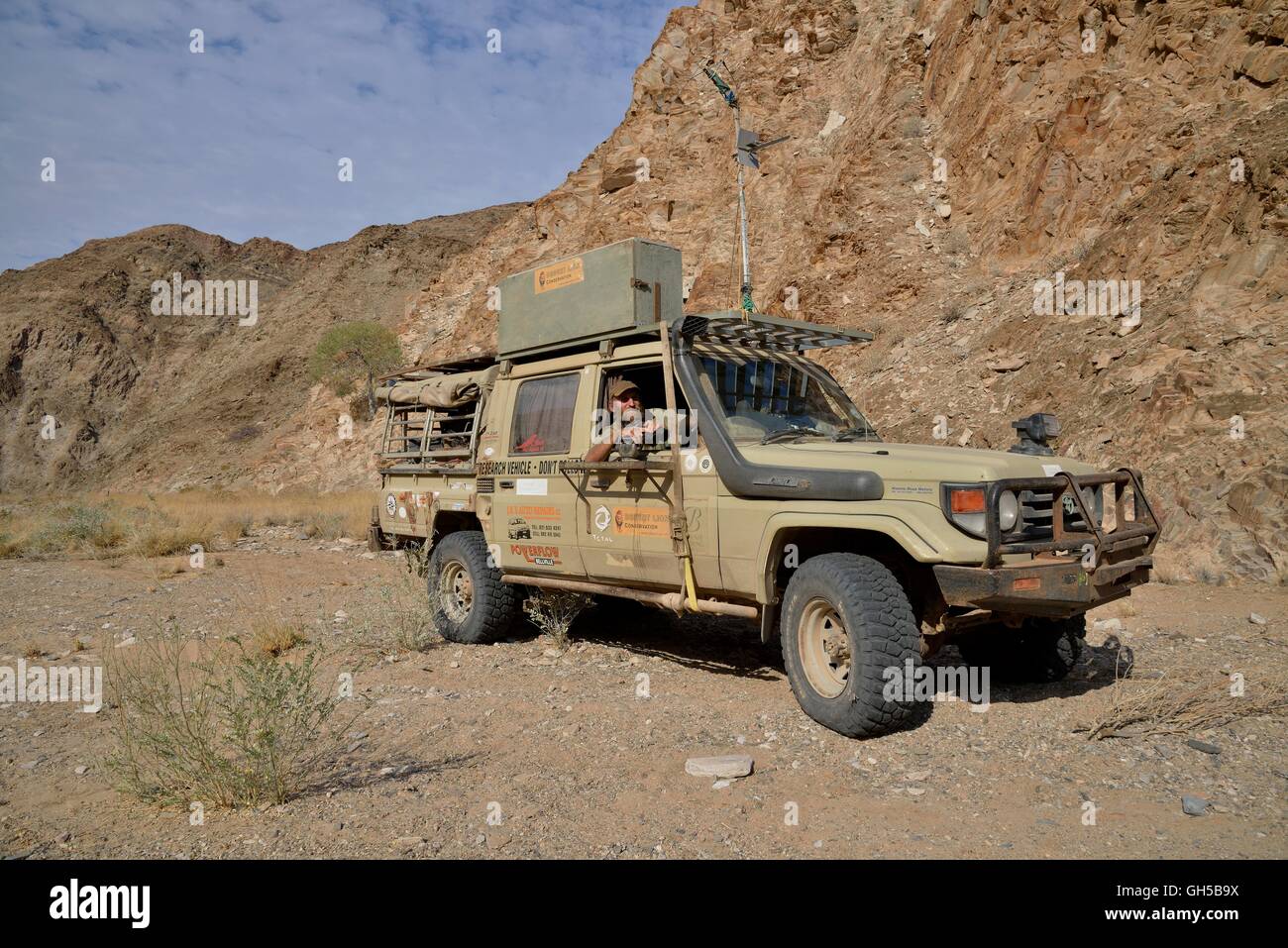 geography / travel, Namibia, lion researcher Dr. Flip Standert in his research vehicle in the Obias riverbed, of a lateral branch of the Hoanib, Kaokoveld, Additional-Rights-Clearance-Info-Not-Available Stock Photo