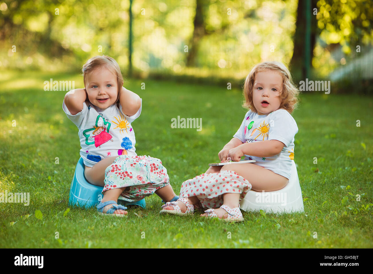 Young girl sitting on toilet hi-res stock photography and images - Alamy