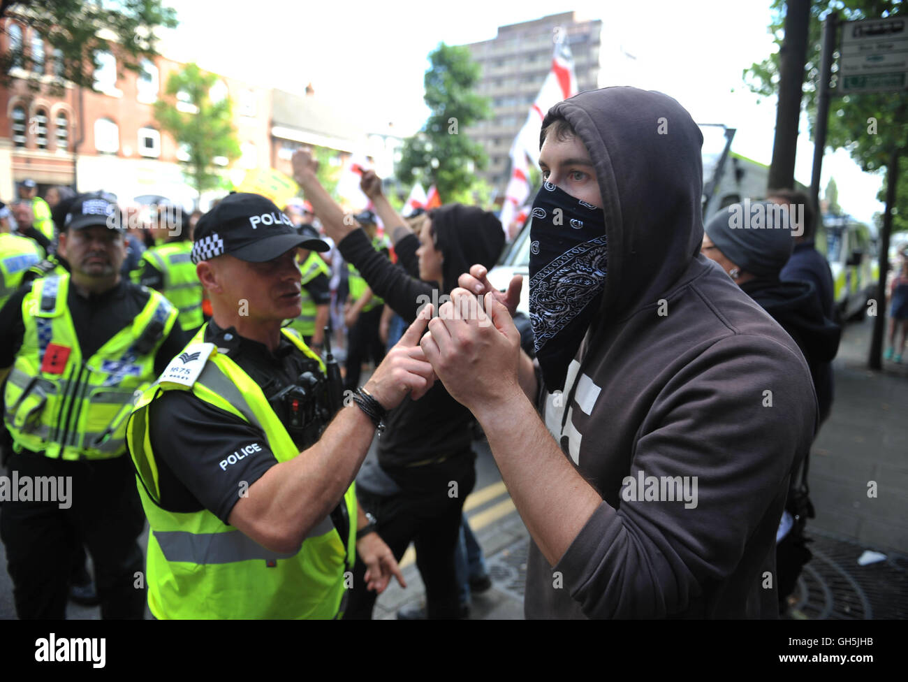 Members of the Nottingham Anti-Fascism group are cordoned off by police as protesters from the far-right group EDL (English Defence League) gather in the city of Nottingham. Nottinghamshire Police cordoned off city centre streets as the group made their way from Castle Wharf to the city centre. Stock Photo