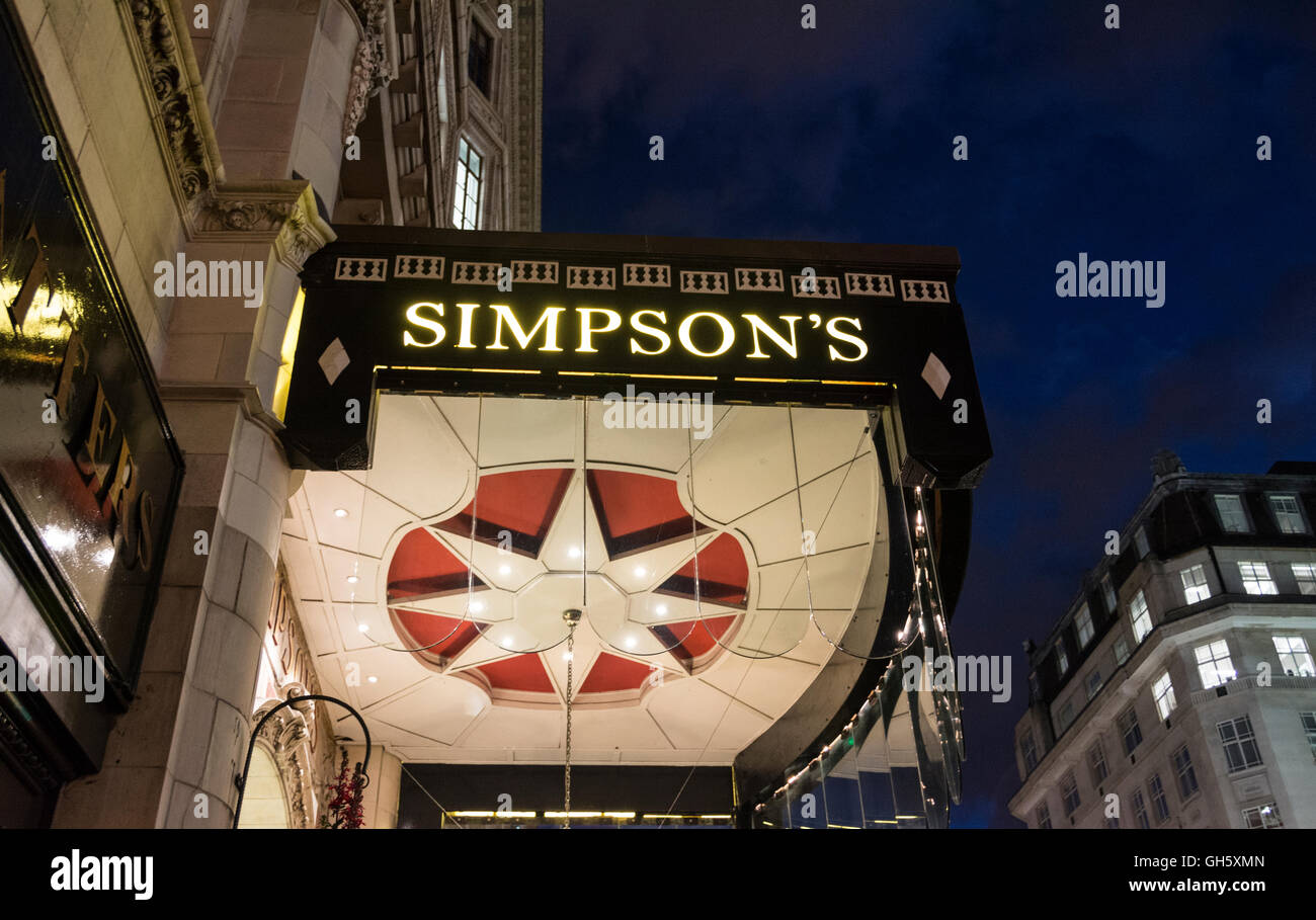 London, England, UK: A night time view of the entrance to Simpson's in the Strand. Stock Photo