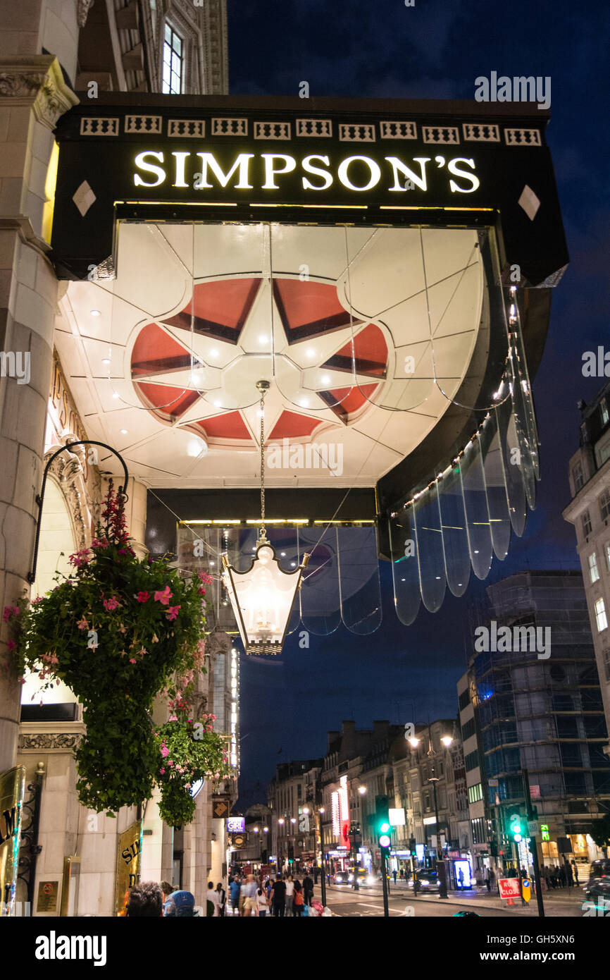 London, England, UK: A night time view of the entrance to Simpson's in the Strand. Stock Photo