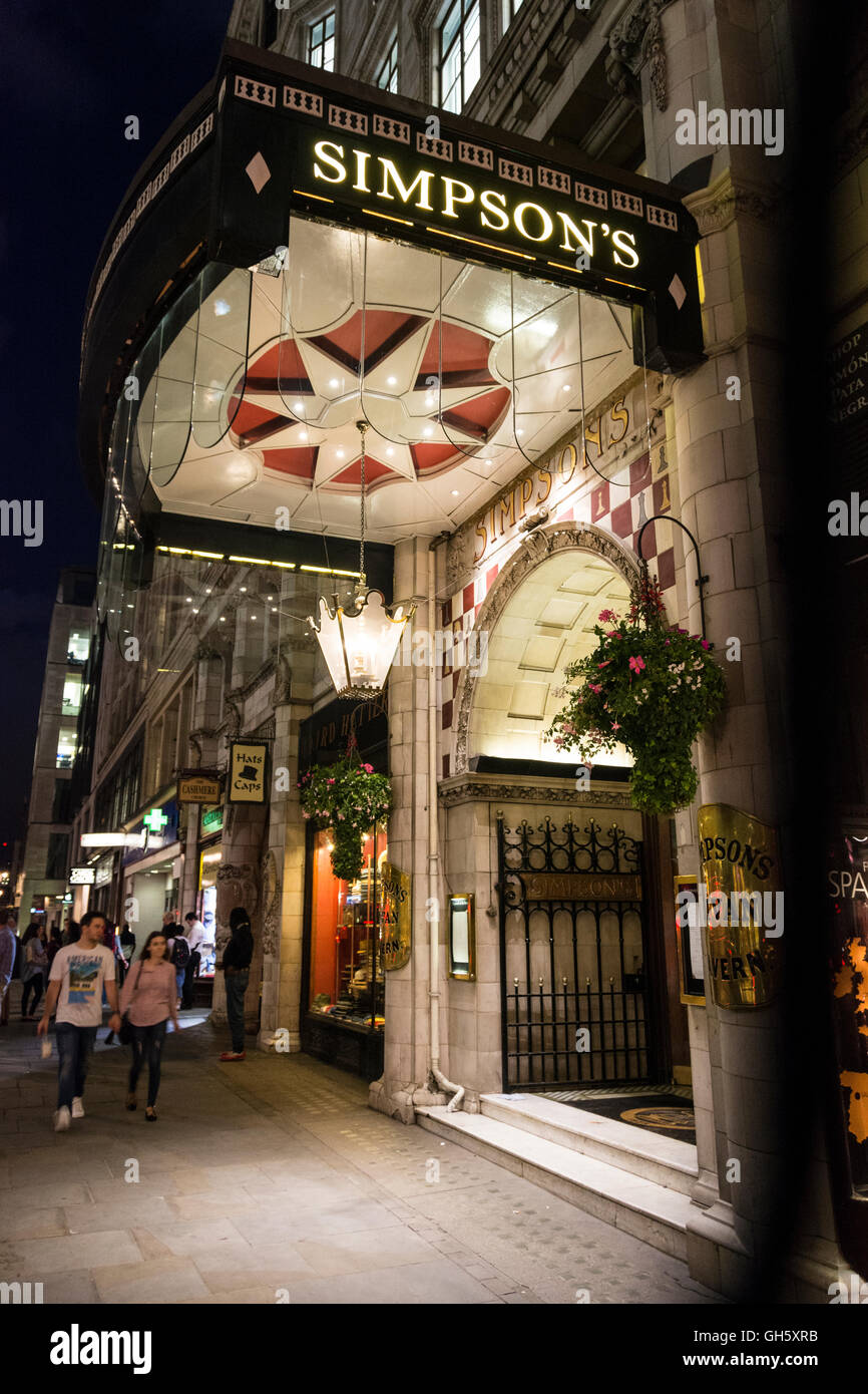 London, England, UK: A night time view of the entrance to Simpson's in the Strand. Stock Photo