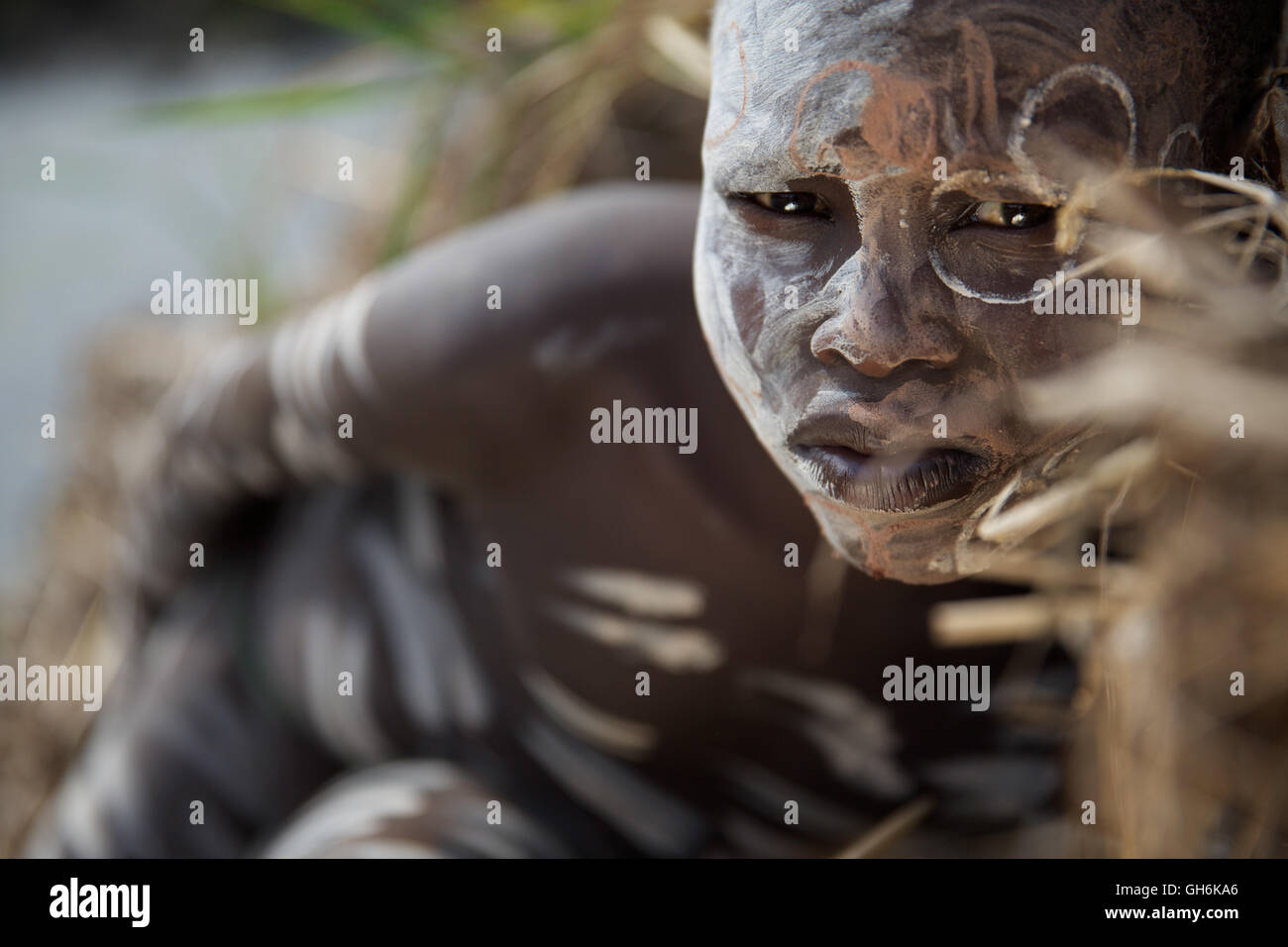 Young boy from Suri tribe with traditional bodypainting. Stock Photo