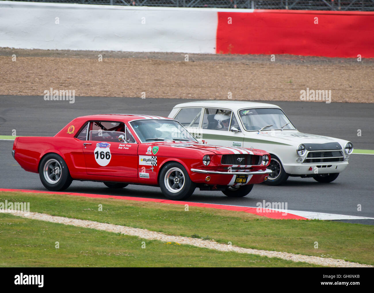 Rob Fenn, Ford Mustang and Andy Wolfe, Ford Lotus Cortina, 2016 Silverstone Classic meeting, England, UK Stock Photo