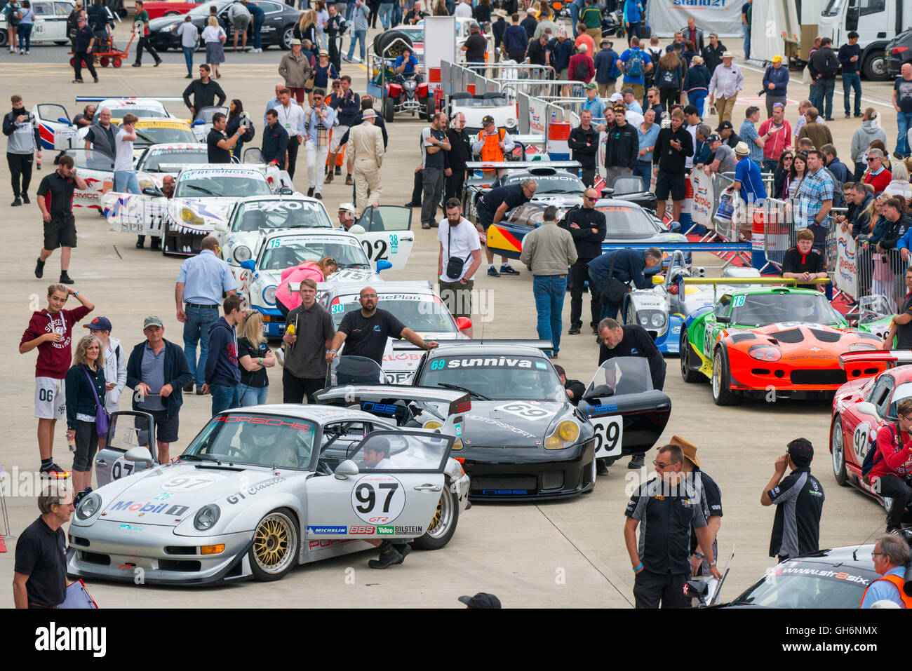 Sports cars lined up in the paddock at Silverstone Classic motor racing event, England, UK Stock Photo