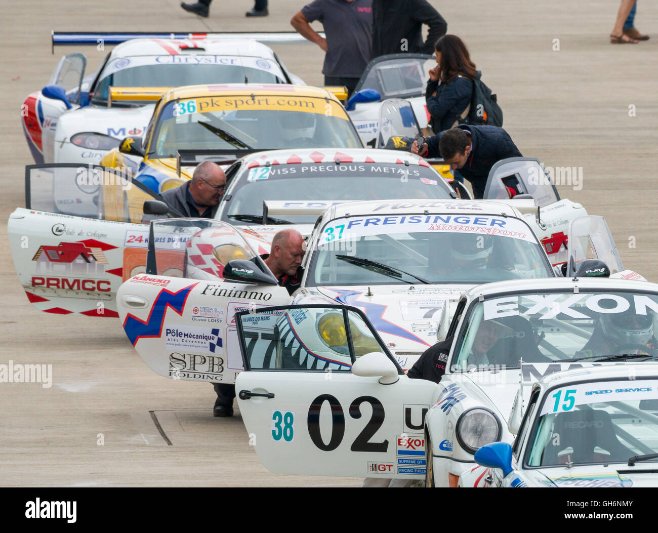 Sports cars lined up in the paddock at Silverstone Classic motor racing event, England, UK Stock Photo