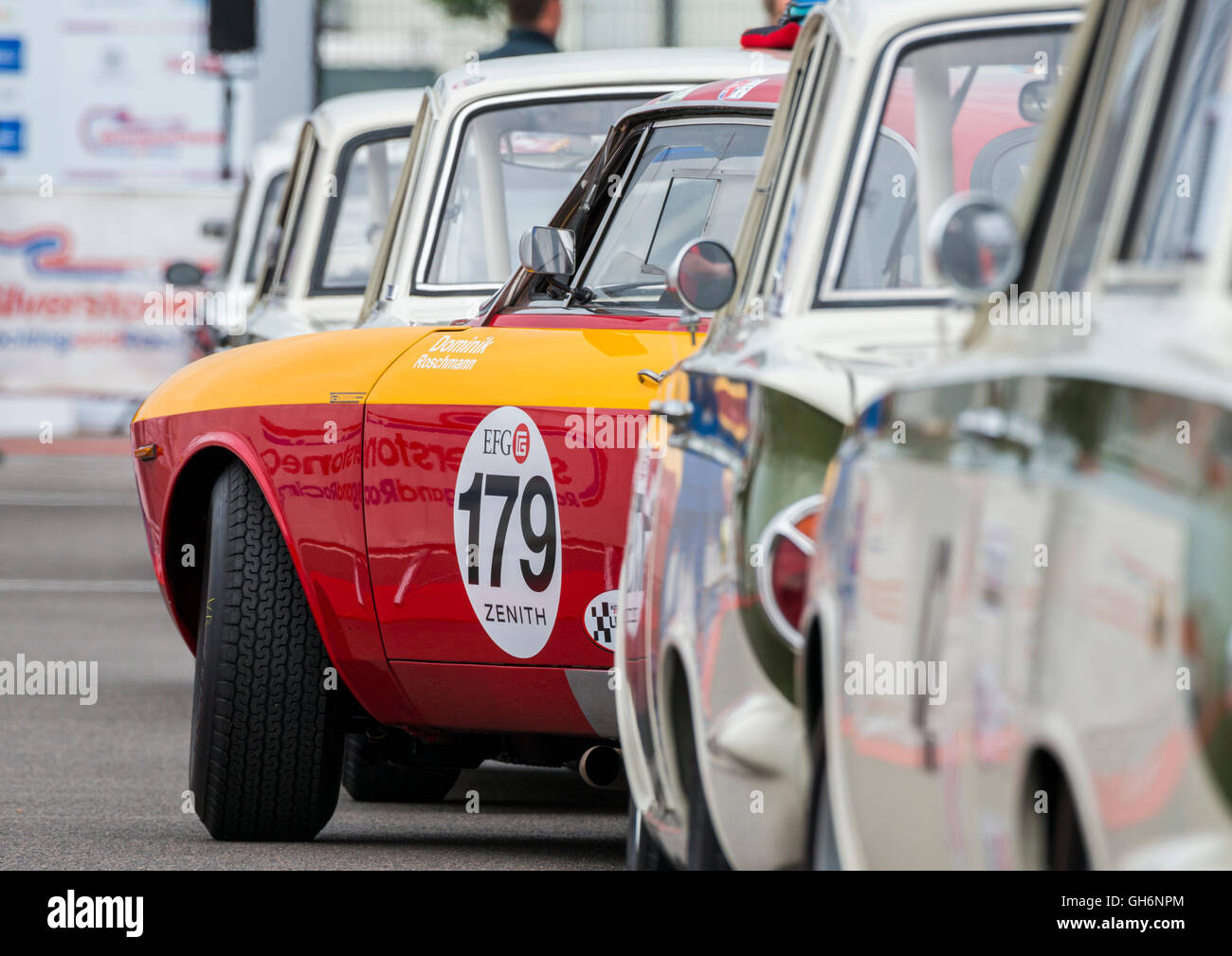 An Alfa Romeo Giulia Sprint GTA in a line of Lotus Cortinas at the 2016 Silverstone Classic event, England, UK Stock Photo