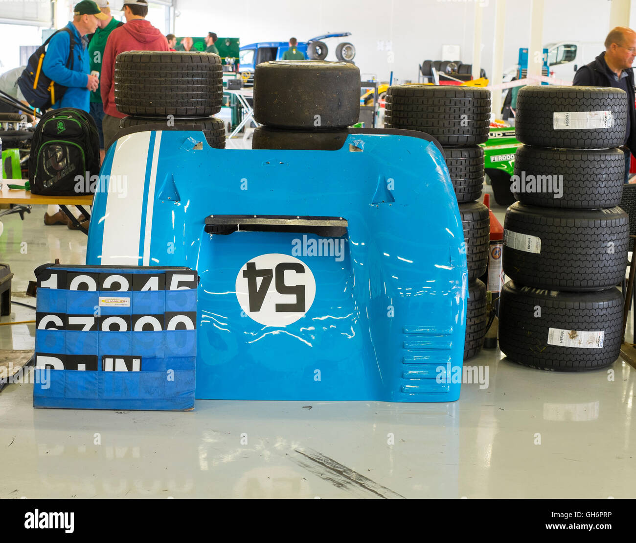 Front of Jonathan Loader's Chevron B19 sports car with race tyres in the pits at 2016 Silverstone Classic event, UK Stock Photo
