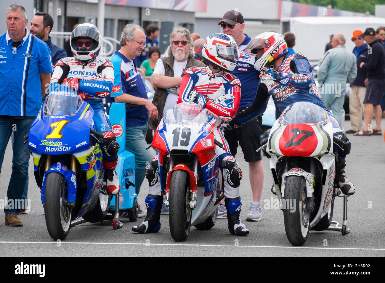 Classic racing motor bikes in the paddock at Silverstone Classic 2016, UK Stock Photo
