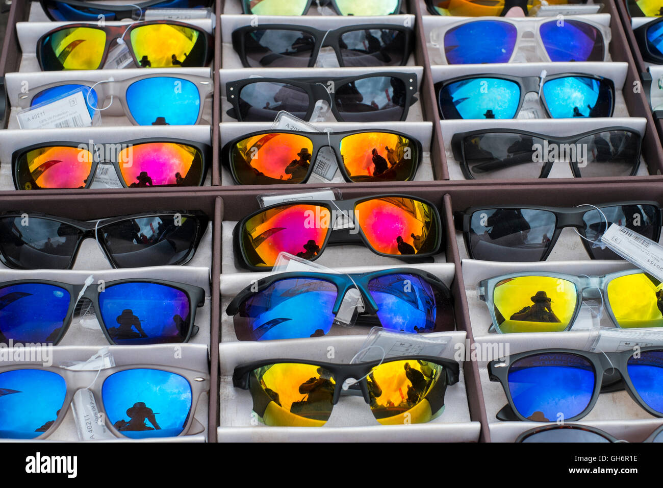 Coloured sunglasses for sale on a stall at the 2016 Silverstone Classic car meeting, England, UK Stock Photo