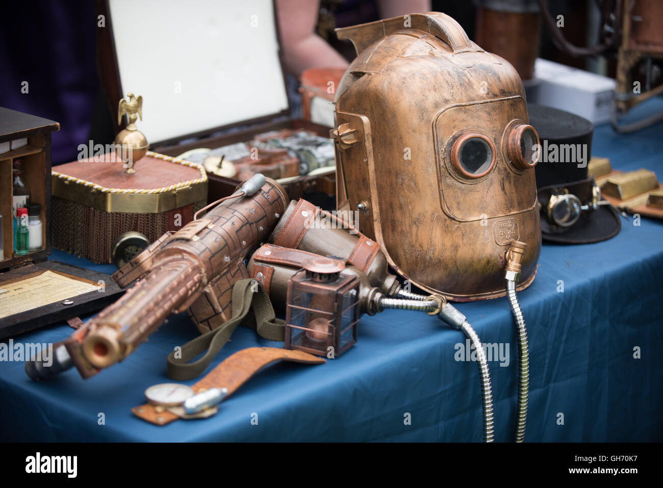 Fire arm and underwater diving helmet for sale on traders stall at papplewick pumping stations steam punk event Stock Photo